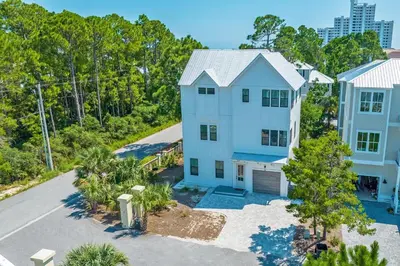 an aerial view of a white house with a driveway at Lifestyles & Dreams in Santa Rosa Beach