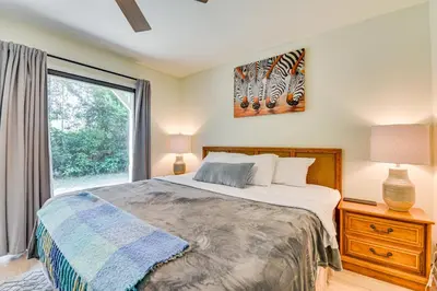 a bedroom with a bed and a large window at Santa Rosa Beach Townhome Patio, Walk to Beach! in Santa Rosa Beach