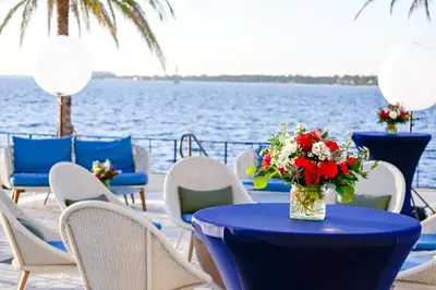 a table with a vase of flowers on top of the water at Hotel Indigo - Panama City Marina by IHG in Panama City