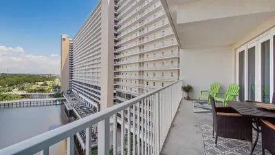 a balcony with a view of a building at Shell Yeah at Laketown Wharf #730 by Nautical Properties in Panama City Beach