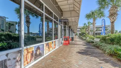 a building with movie posters on the side of it at Shell Yeah at Laketown Wharf #730 by Nautical Properties in Panama City Beach