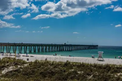 a view of a beach with a pier at Tidewater 2204 in Panama City Beach