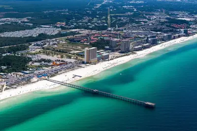 an aerial view of a beach with a bridge over the water at Tidewater 2204 in Panama City Beach