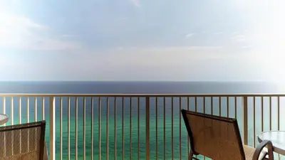 a view of the ocean from the balcony of a resort at Tidewater 2613 in Panama City Beach