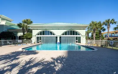 a swimming pool in front of a building at Celadon 209 in Panama City Beach