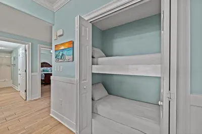 a walk in closet with bunk beds in a room at Treasure Island #1505 in Panama City Beach
