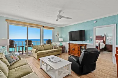 a living room with a view of the ocean at Treasure Island #1505 in Panama City Beach