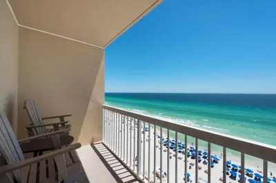 a balcony with chairs and a view of the ocean at Seychelles #1007 in Panama City Beach