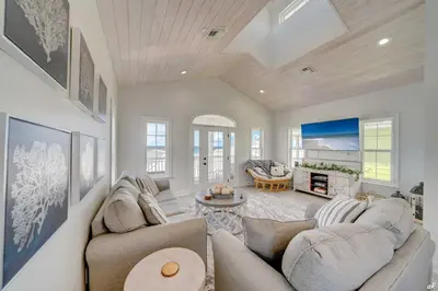 a living room with a couch and a table at Summer Towne Cottages #16 in Panama City Beach