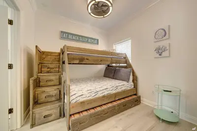 a bedroom with a bunk bed in a room at Summer Towne Cottages #16 in Panama City Beach
