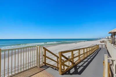 a boardwalk leading to a beach with the ocean at Treasure Island #2110 in Panama City Beach