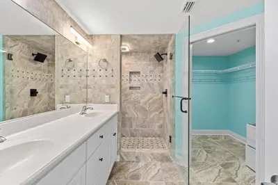 a bathroom with a white sink and a shower at Treasure Island #1506 in Panama City Beach