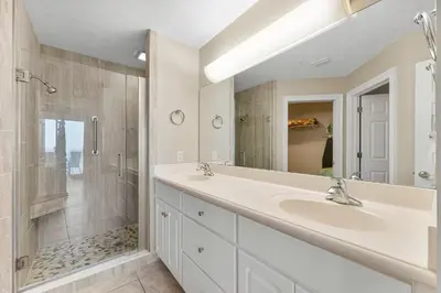 a bathroom with two sinks and a shower at Treasure Island #0507 in Panama City Beach