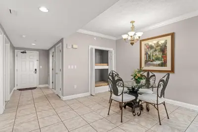 a dining room with a table and chairs at Treasure Island #1807 in Panama City Beach