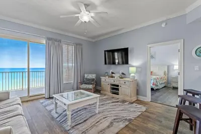 a living room with a view of the ocean at Treasure Island #0409 in Panama City Beach