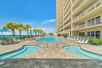 a swimming pool in front of a building at Gulf Crest #0106 in Panama City Beach