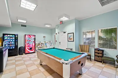 a room with a pool table and a soda machine at Gulf Crest #0106 in Panama City Beach
