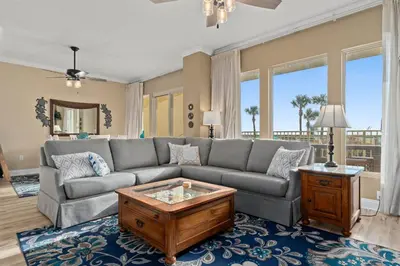 a living room with a couch and a coffee table at Gulf Crest #0106 in Panama City Beach