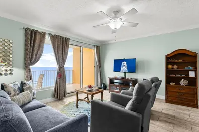 a living room with two couches and a tv at Treasure Island #1710 in Panama City Beach
