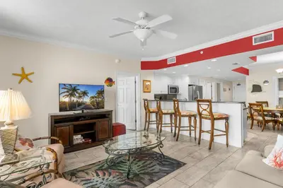 a living room with a couch and a table at Treasure Island #1609 in Panama City Beach