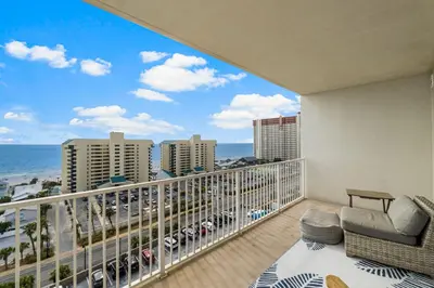 a balcony with a view of the ocean at OCEAN VIEW 10th floor condo at the Laketown Wharf 1004 in Panama City Beach