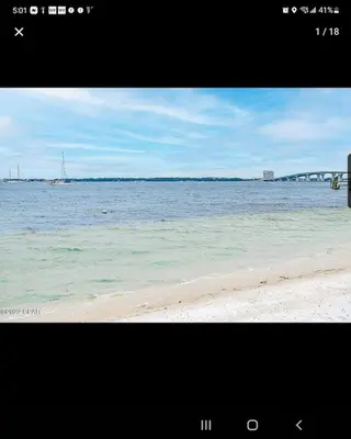 a view of the beach with a boat in the water at Historic GWALTNEY HOUSE-Cottage at St Andrew's Bay in Panama City