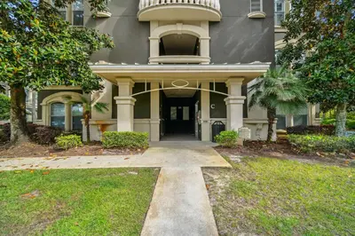 a house with a walkway leading to the front door at 30A Sea View Villas by Panhandle Getaways in Santa Rosa Beach
