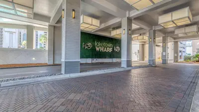 an empty lobby of a building with a sign on it at Laketown Wharf #124 by Nautical Properties in Panama City Beach