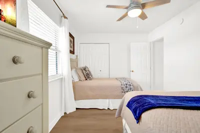 a bedroom with two beds and a ceiling fan at Sandcastles and Sunshine - Gulf Highlands Beach Resort in Panama City Beach