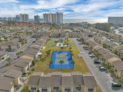 an aerial view of a residential neighbourhood with a pool at Sandcastles and Sunshine - Gulf Highlands Beach Resort in Panama City Beach