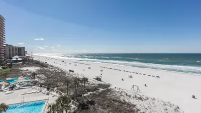 an aerial view of a beach with people and the ocean at 5-STAR BEACHFRONT D505 - Total Remodel - Nov & Dec Snowbirds Welcome! in Panama City Beach